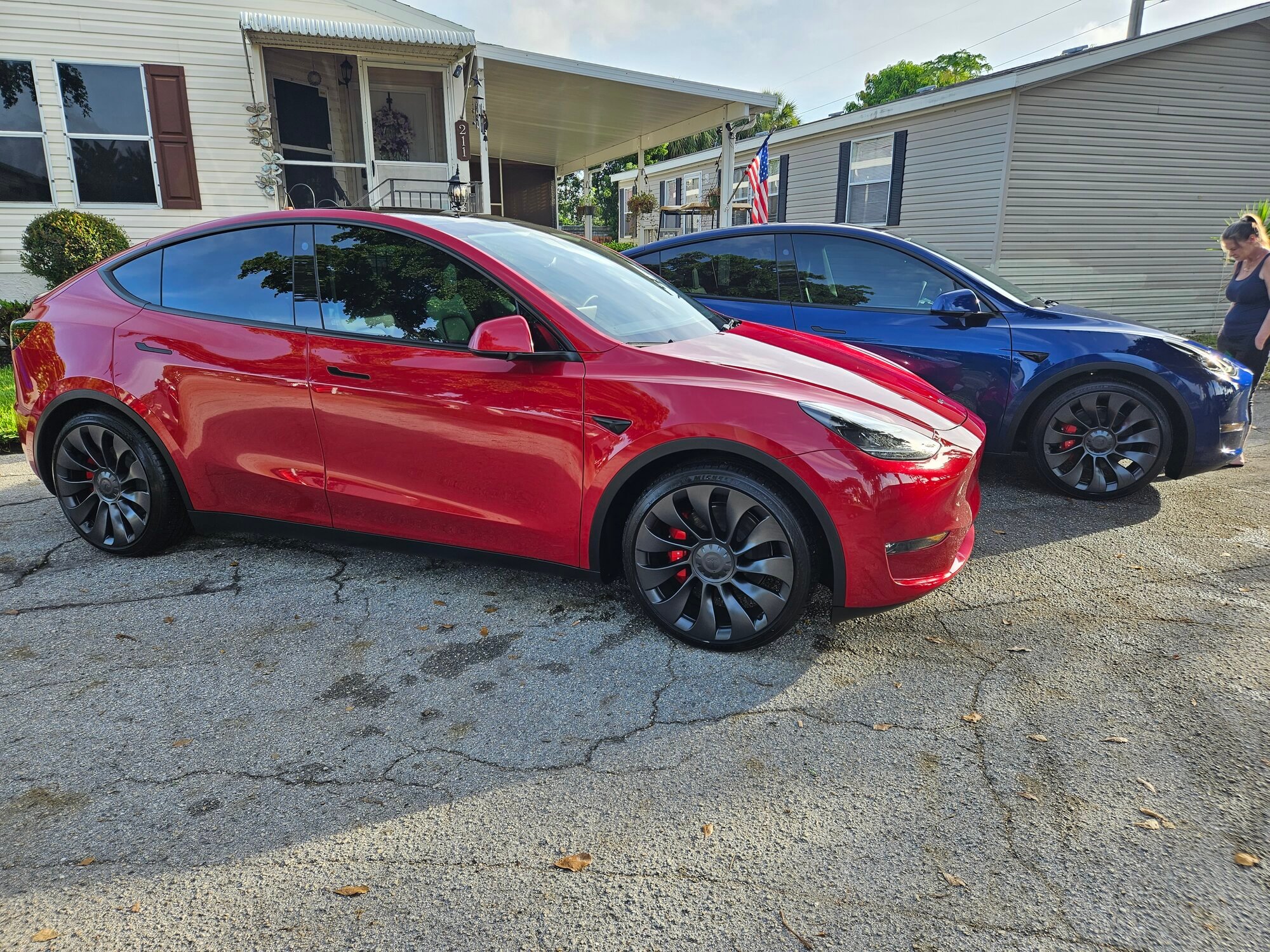 1 week after delivery couldn't be happier 2 x 2023 Model Y Performance red  and blue