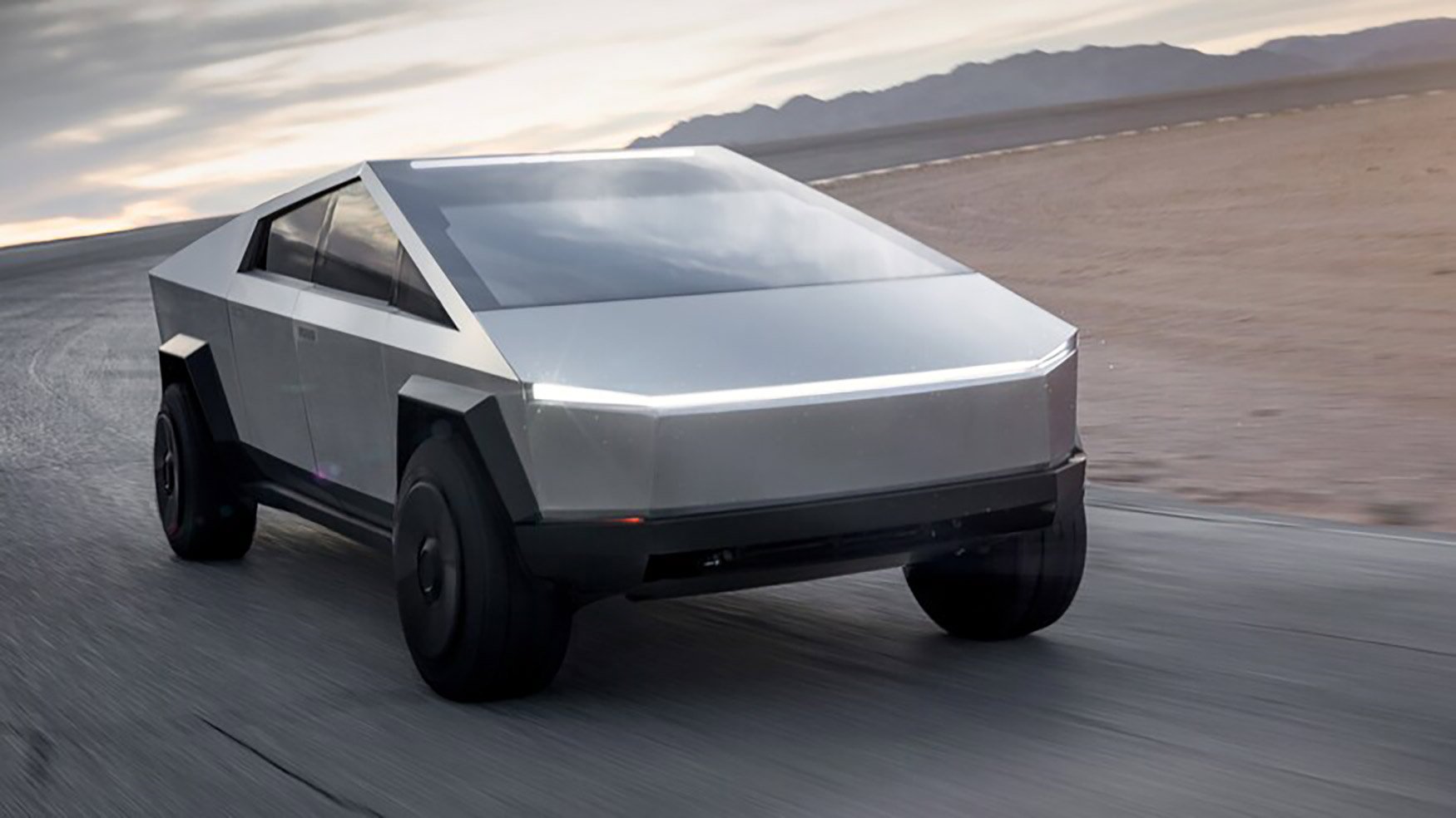 4-Tesla-Cybertruck-Electric-Pickup-Truck-Front-3-4-in-Motion-on-Road-Course-2Before.jpg