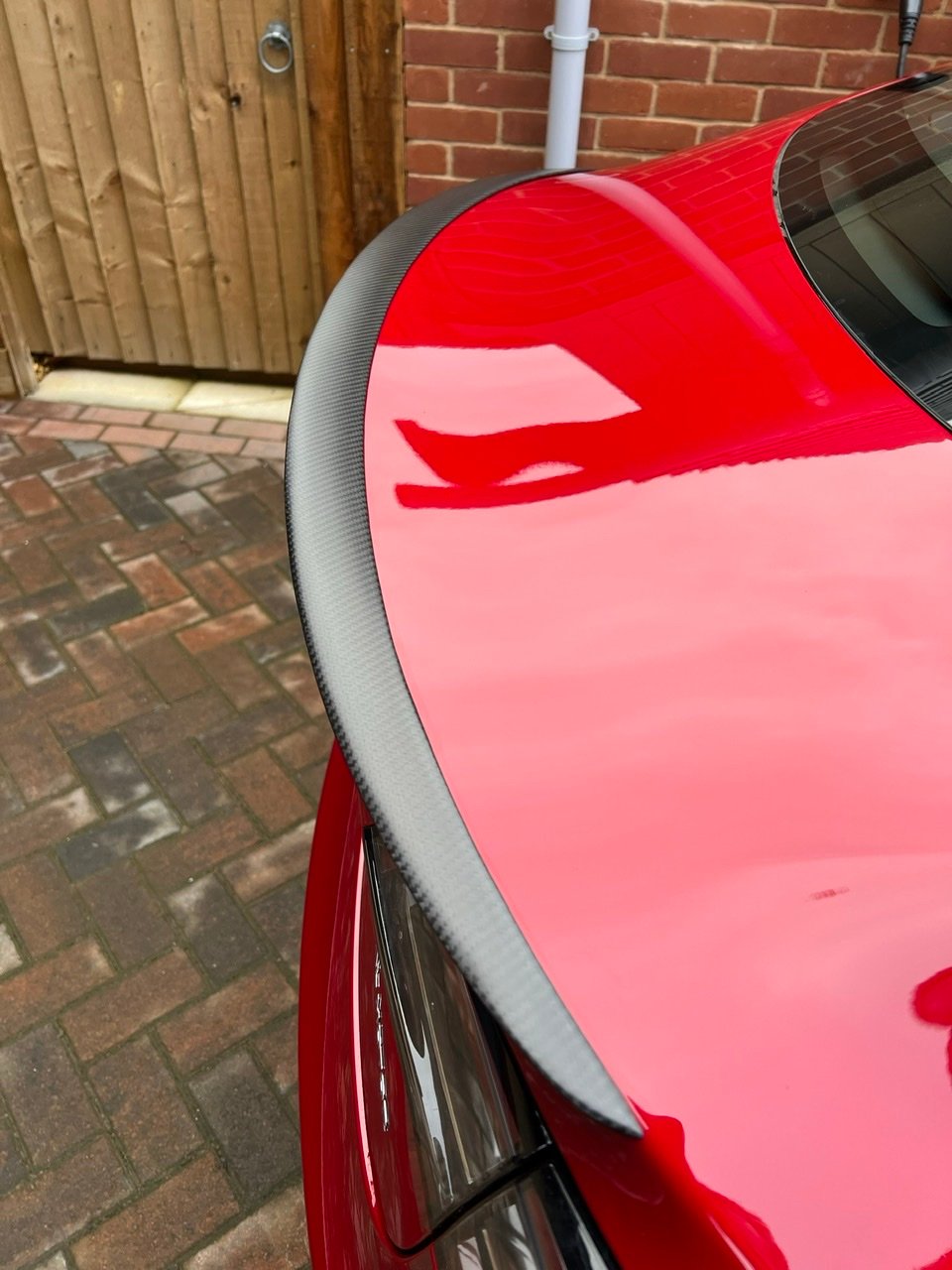 Anyone have Tesla upgrade their MYLR with the carbon fiber spoiler