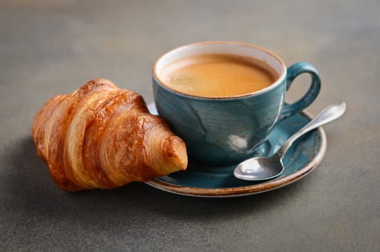 canva-cup-of-fresh-coffee-with-croissant-on-concrete-background.-MADauFQmvOs[1].jpg