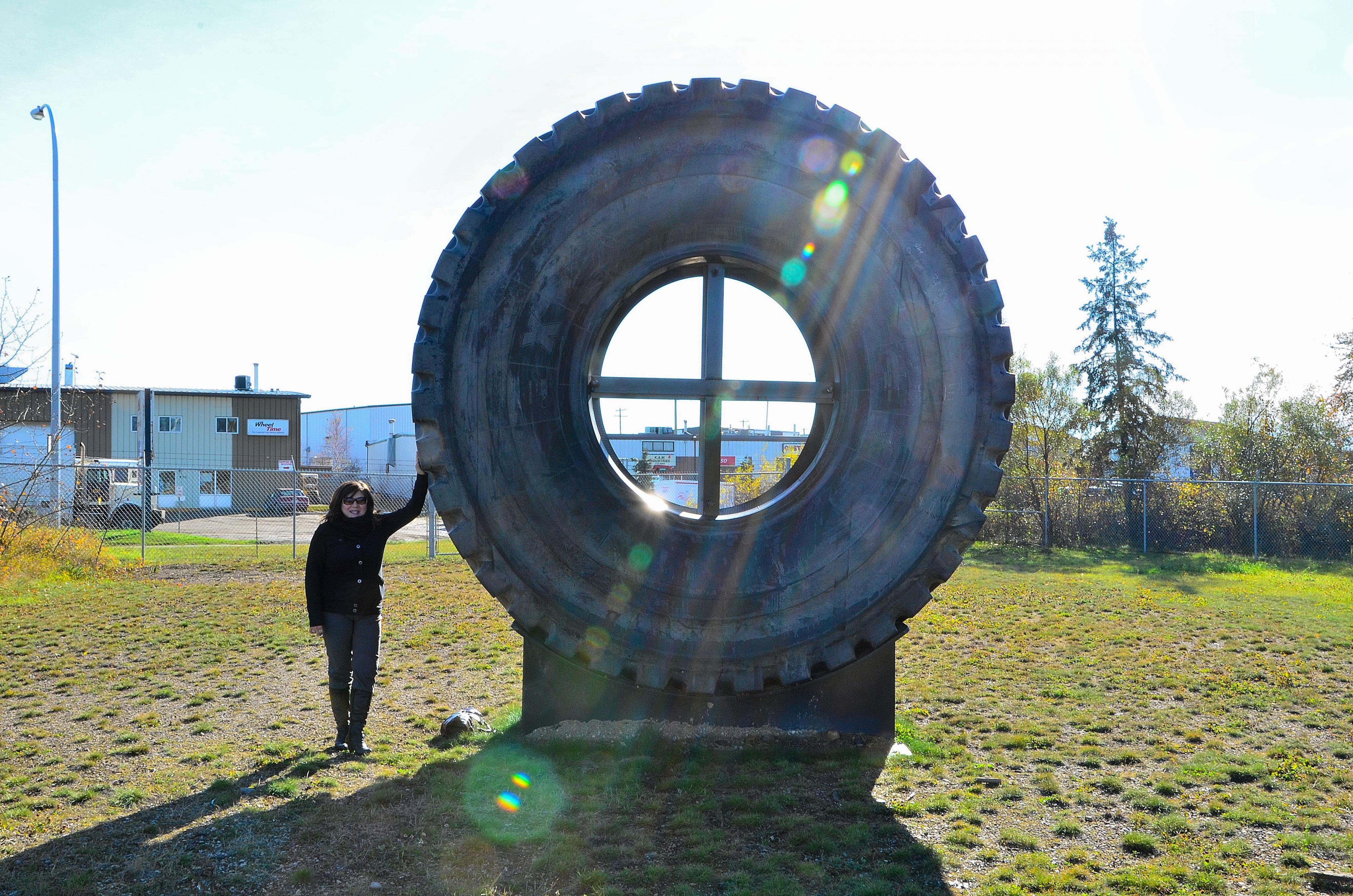 gail-with-a-caterpillar-797-tire-at-the-osdc.jpg