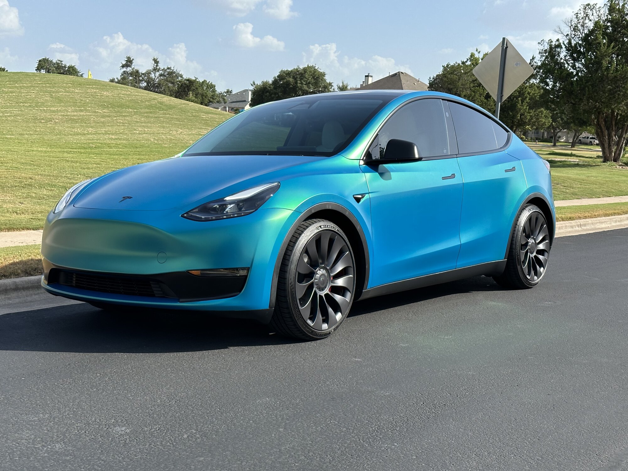 Electrifying Elegance: Tesla Model Y Transformed with 3M Gloss Atomic Teal  Wrap – Wrap Bullys