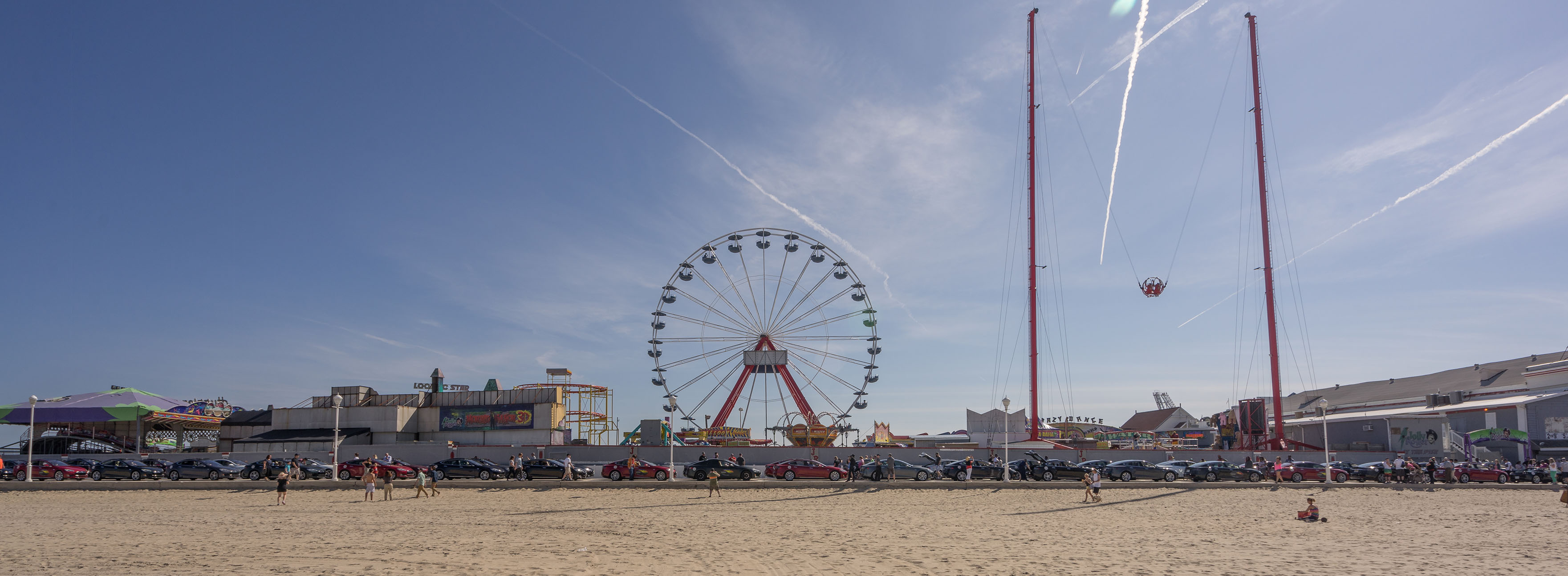 Pano of Tesla's lined up for the Boardwalk with Ferris Wheel.jpg