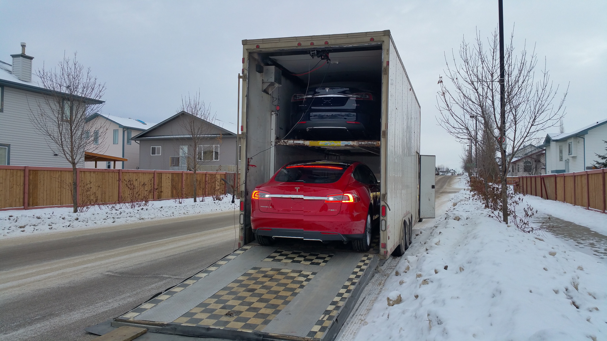tesla coming out of trailer.jpg