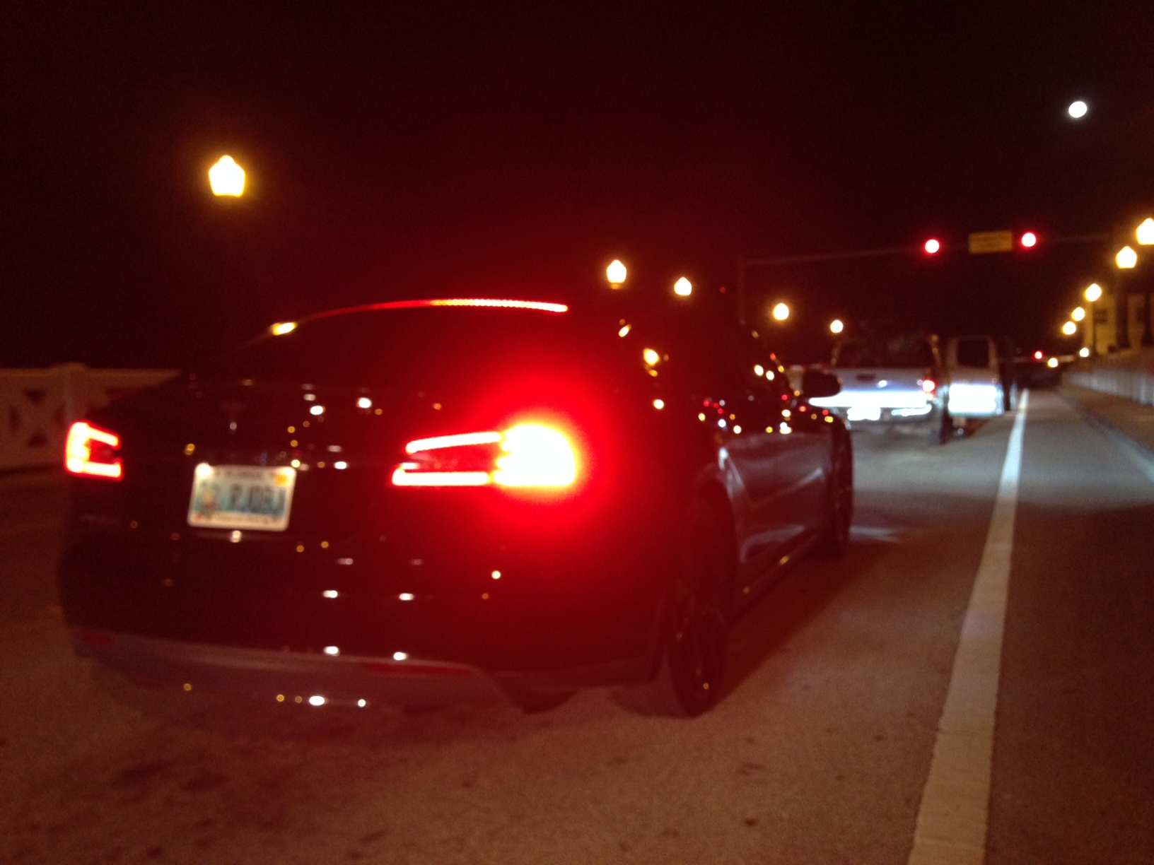 Tesla in Miami waiting to cross a bridge.JPG