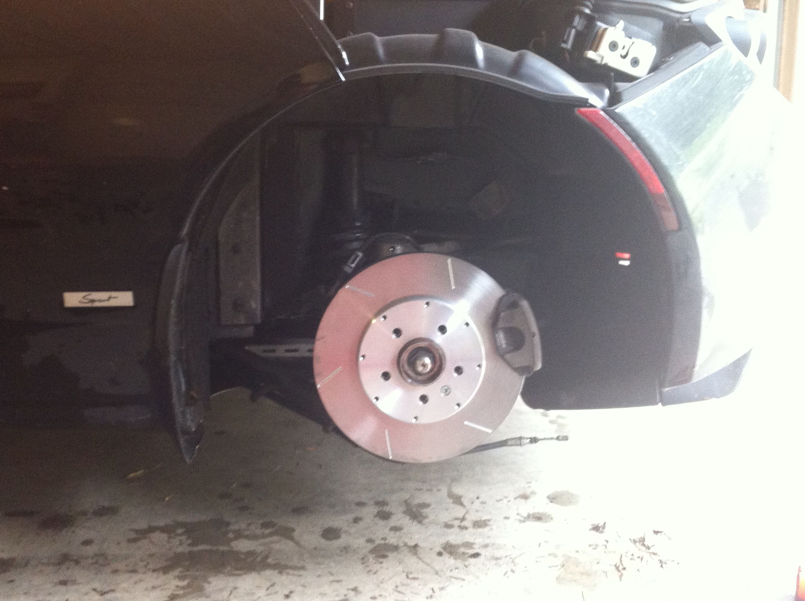 Tesla rear rotor, prototype installed fender, 03-19-2015.jpg