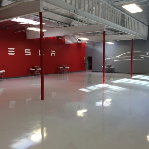 New car delivery area, very clean. The walls are lined in NEMA 14–50 plugs.